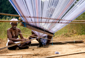 A weaver preparing the warp in a village near Kanchipuram, India. Claude Renault
